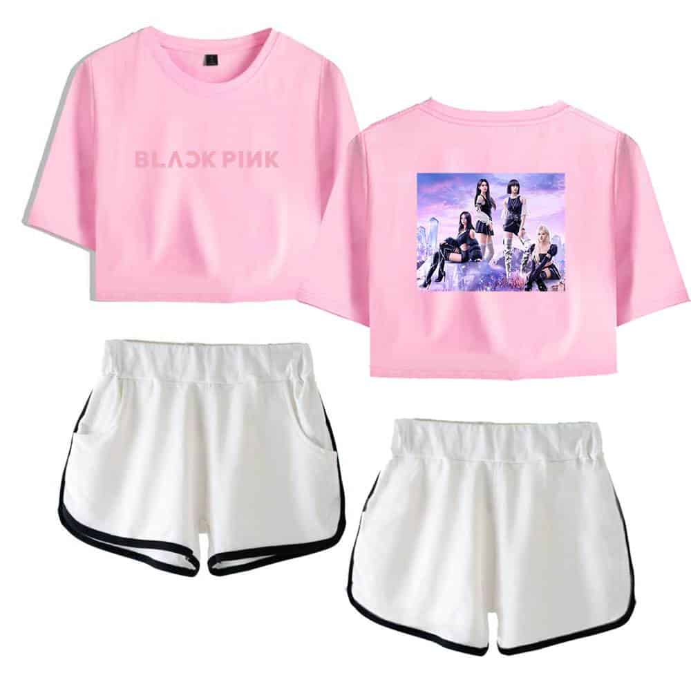 Pink K-pop merchandise crop top with BLACKPINK logo and girl group image print, paired with white sporty shorts with black trim.