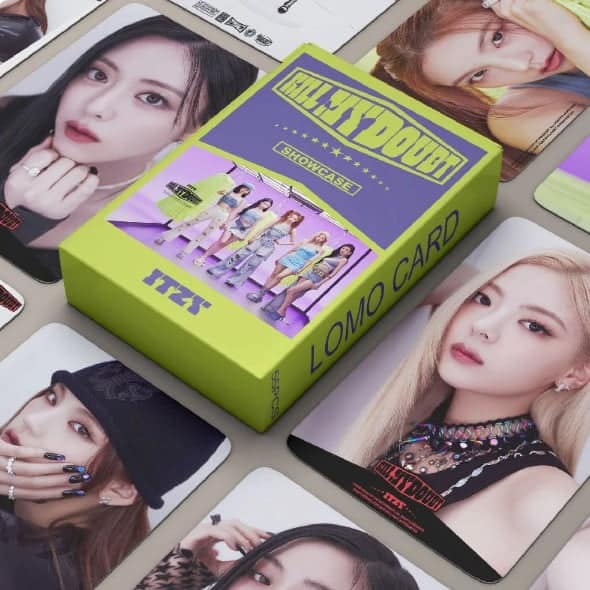 Adorable kpop group photo card with colorful packaging, surrounded by various idol images, perfect for fans collecting merch and showcasing their love for favorite K-pop artists.