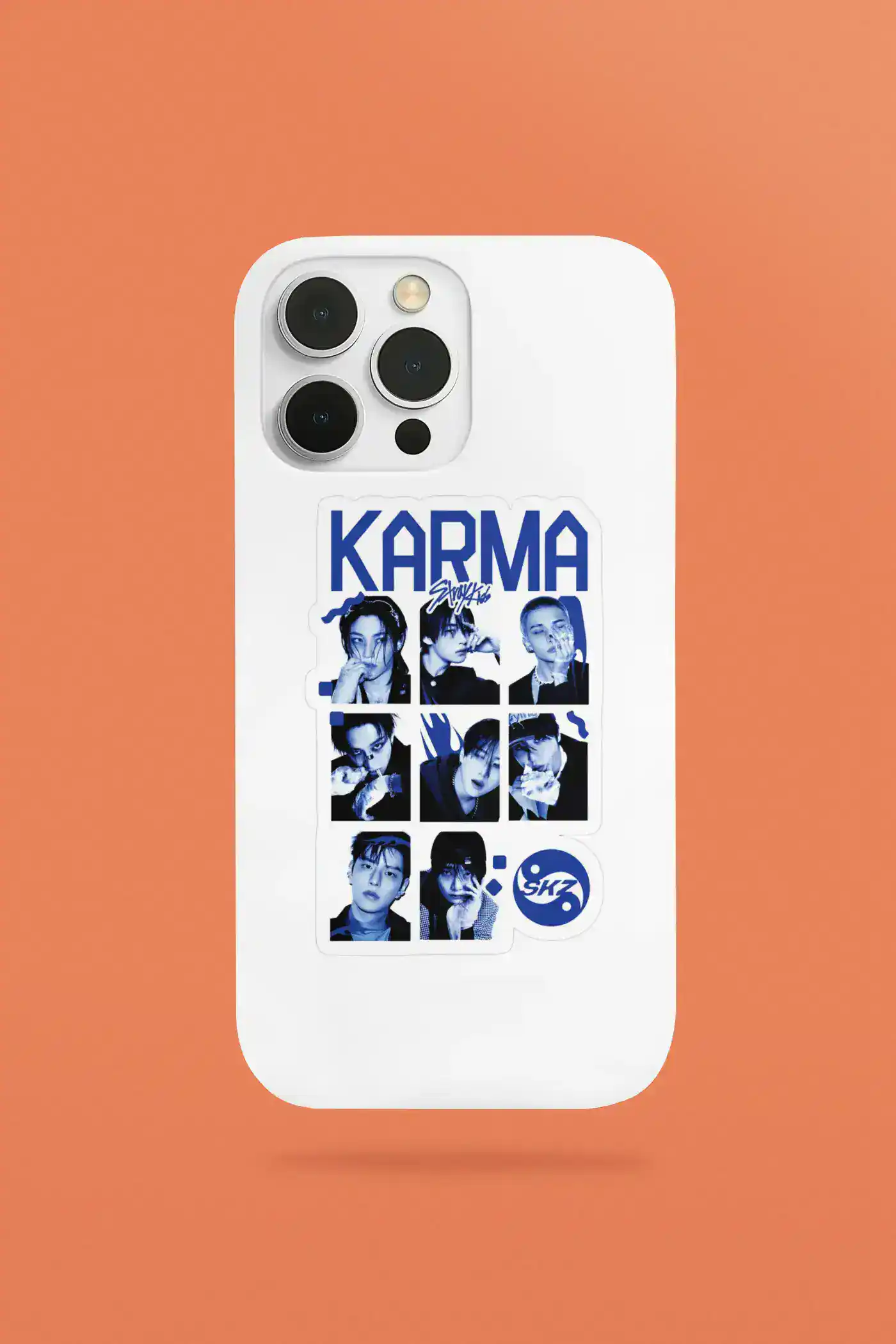 Colorful K-pop merch sticker featuring members of SKZ on a white phone case.