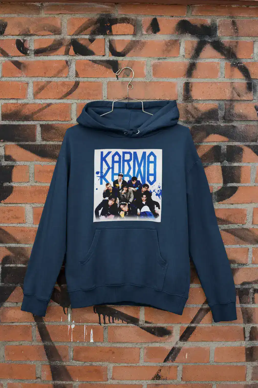 Kpop merch hoodie featuring a group photo of the K-pop band KARMA.