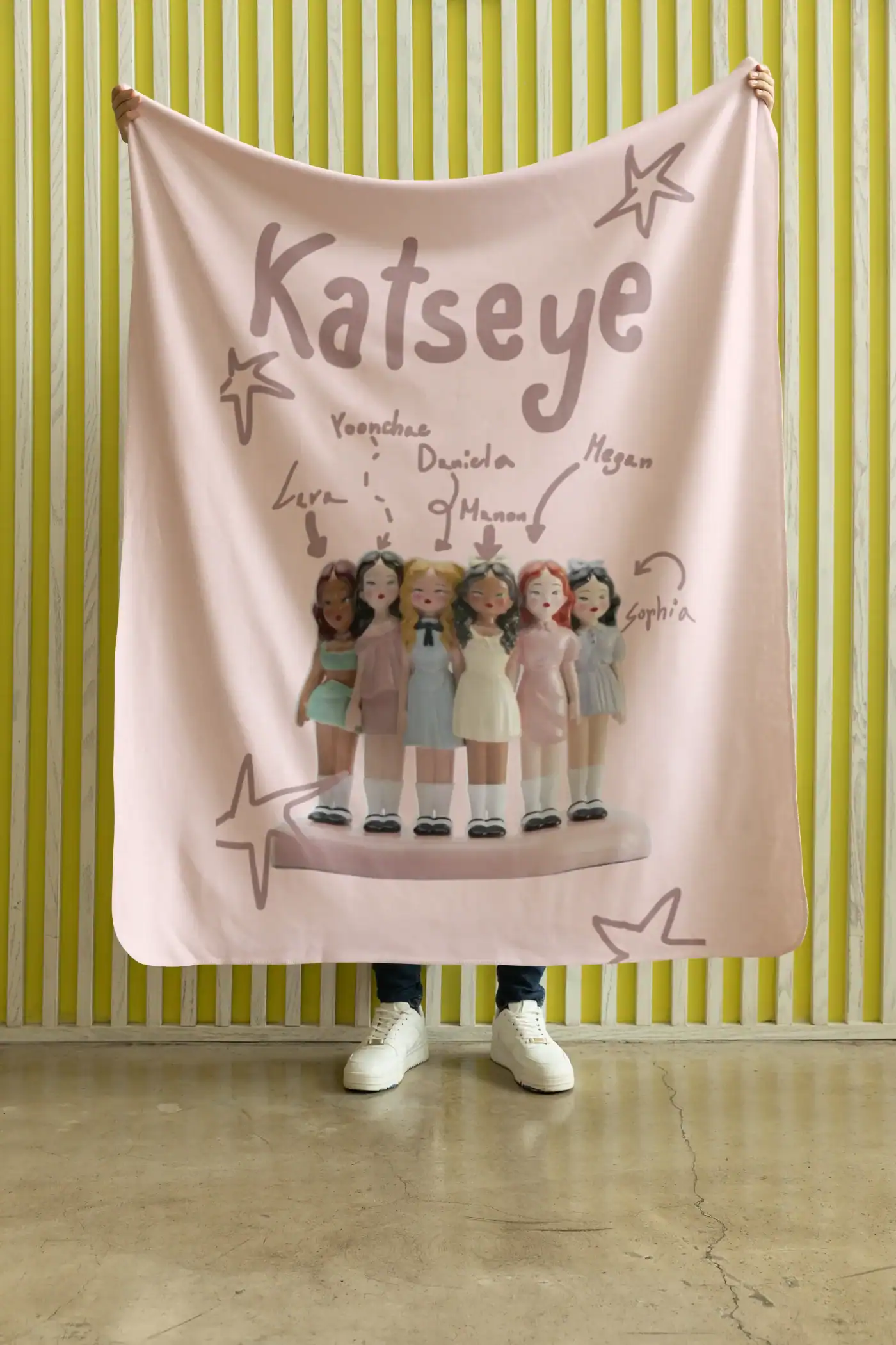 Kpop merchandise blanket featuring cartoon dolls of popular girl group members with personalized names and signatures.