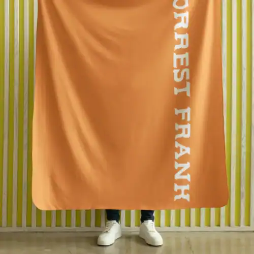 Forte Italian fan banner held by a person standing in front of a striped yellow wall.