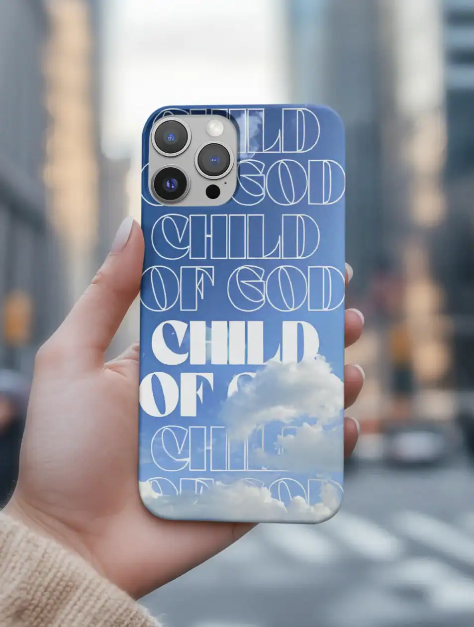 Blue phone case with white text and clouds design, featuring "Child of God" written multiple times in different fonts.
