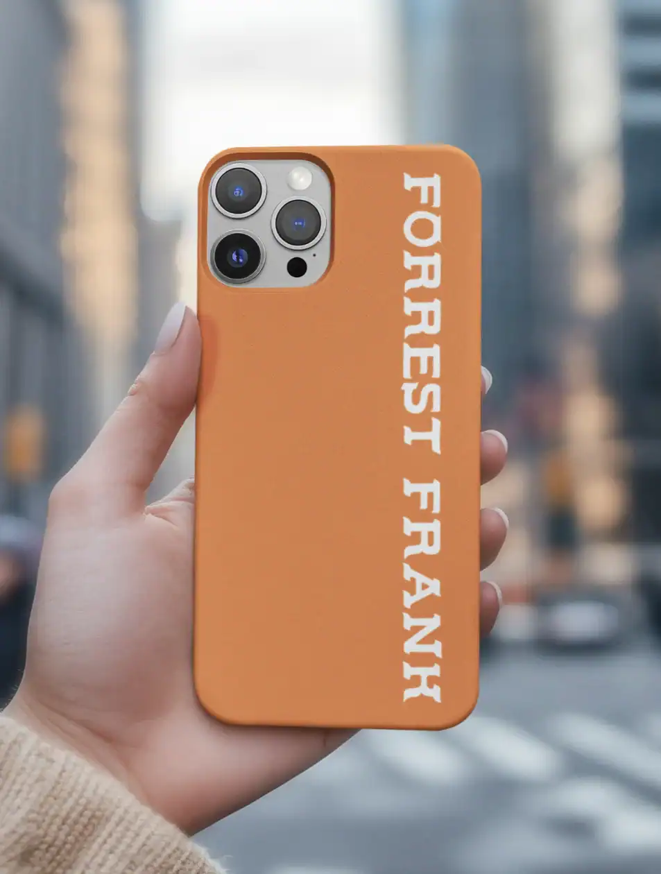 Cute orange phone case with "FORGIVE I FRANK" text, perfect for K-pop merchandise fans.