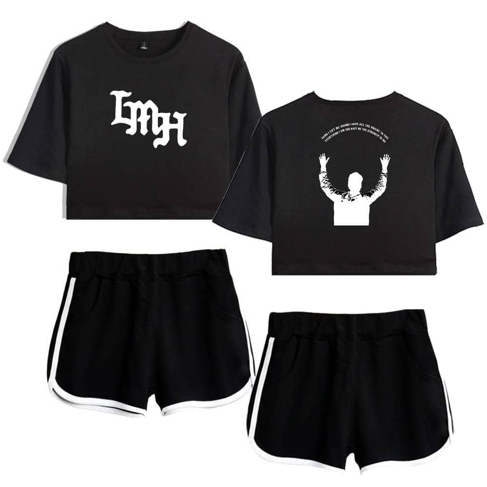 Dark cropped T-shirt with bold graphic print and matching sporty black shorts with white trim.