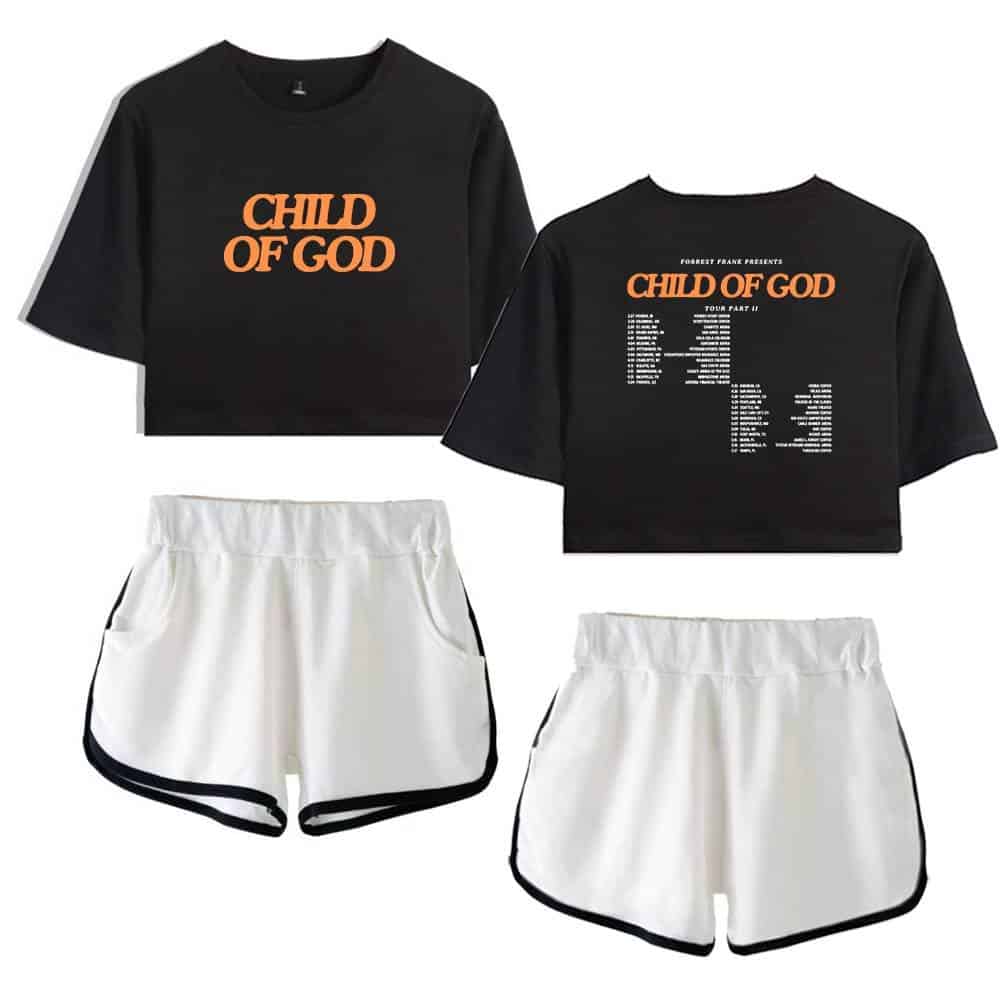 Child of God black cropped t-shirt with orange print and white shorts with black trim, Kpop merchandise shirt and athletic shorts.