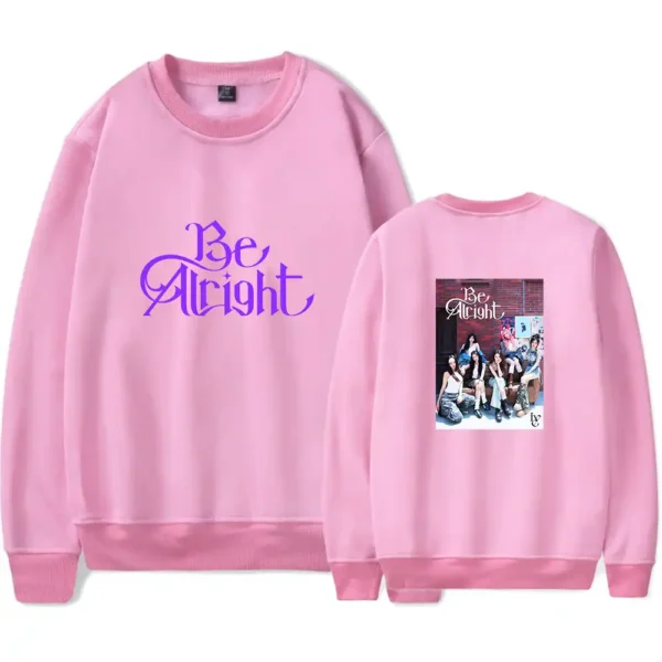 Be Bright pink sweatshirt featuring a group photo of K-pop idols.