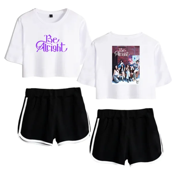 Be alright crop top with group photo printed on back of t-shirt, stylish black shorts with white trim.