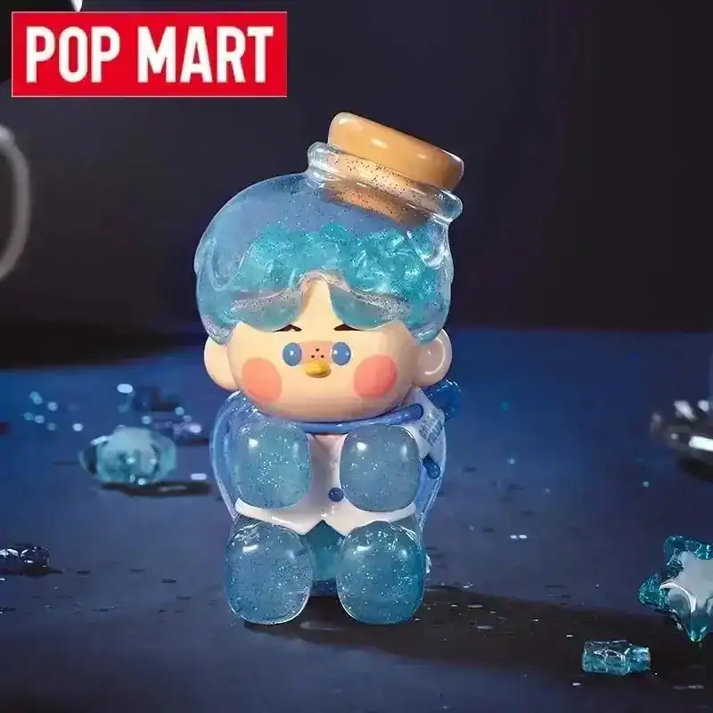Cute cartoon character keychain with blue hair and glitter details, perfect for K-pop merchandise fans.
