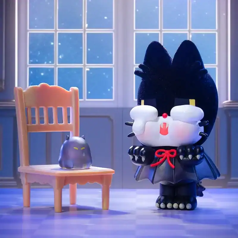 Cute plush toy of a black cat dressed as a vampire with a red bow, sitting in front of a small ghost plush on a chair, inside a cozy room with large windows and snow outside.