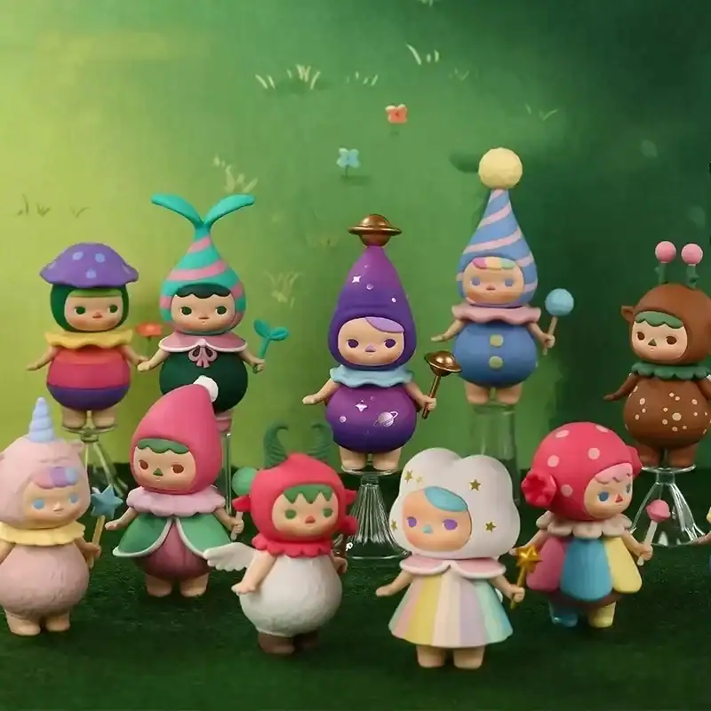 Kpop merch figures of cute whimsical characters with pastel colors and galaxy-themed accessories.