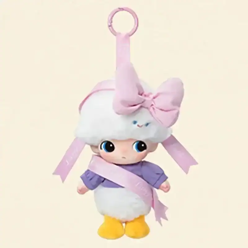 Cute plush toy keychain girl doll with large blue eyes and pink bow, perfect for K-pop merchandise fans.