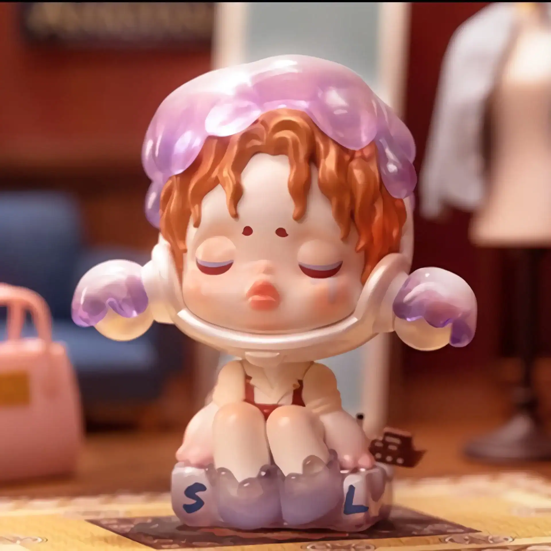 Cute anime girl figurine wearing a space helmet, with soft pastel colors and detailed features, perfect for K-pop merchandise collectors.