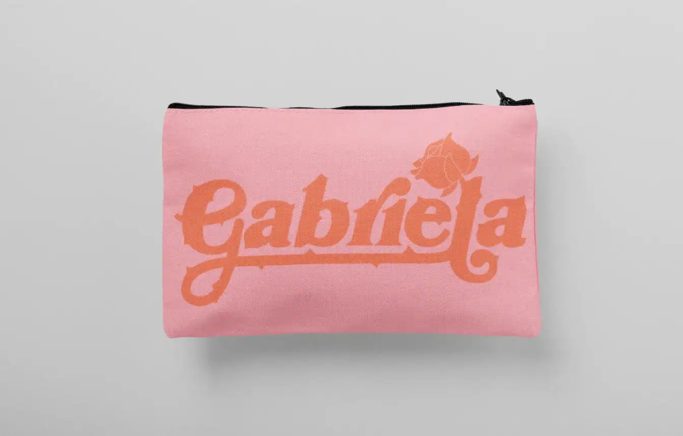 Gabriel pink clutch bag with orange logo design and rose illustration.