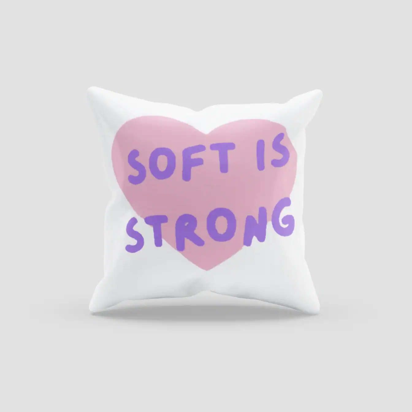 Soft is strong kpop merchandise pillow with pink heart and purple text.