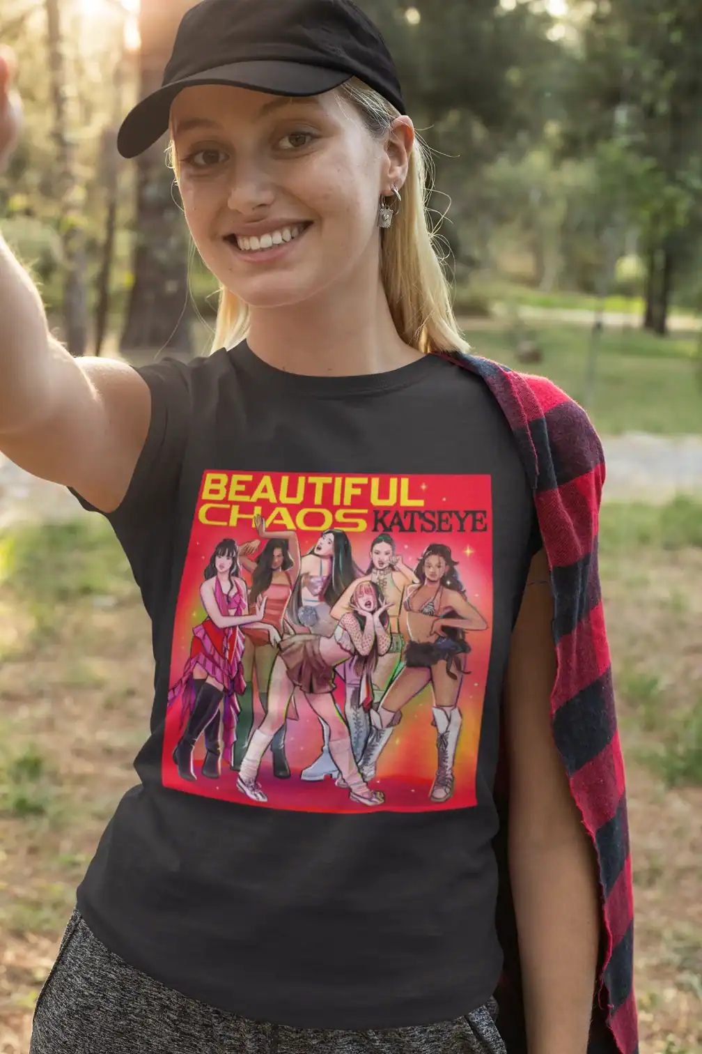 Kpop merch featuring a group of animated K-pop girl group characters on a black T-shirt.