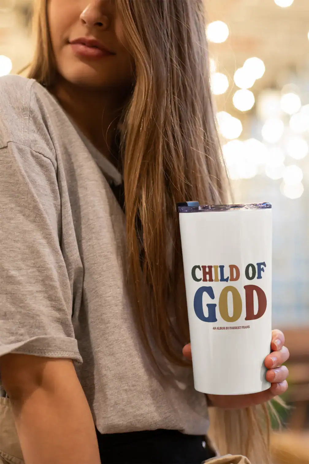 Child of god mug with colorful text and font style.